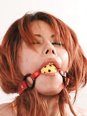 Moe Aizawa Asian with boobs in yellow ropes is fingered in slit