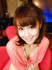 Maika Asian with cans in fishnet blouse puts vibrator on beaver