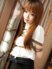 Dimdim Asian in tight office skirt and blouse is tied in ropes