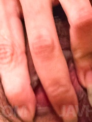 Eve Asian nymphet rubs her cunt with long nails and sucks shlong