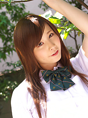 Schoolgirl Iyo Hanak poses at the open air in sexy skirt