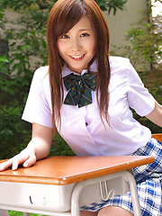 Schoolgirl Iyo Hanak poses at the open air in sexy skirt